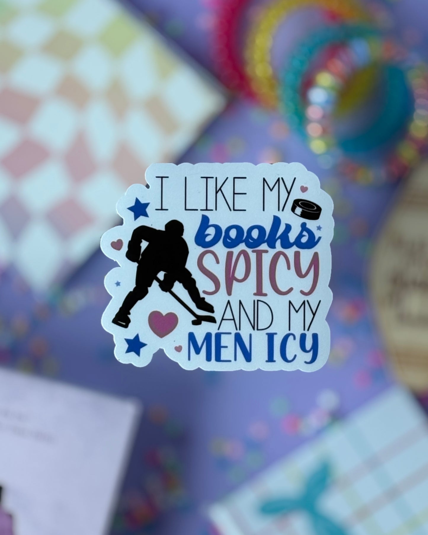 Hockey romance sticker with the text “I Like My Books Spicy & My Men Icy” featuring a hockey player silhouette and pastel hearts.