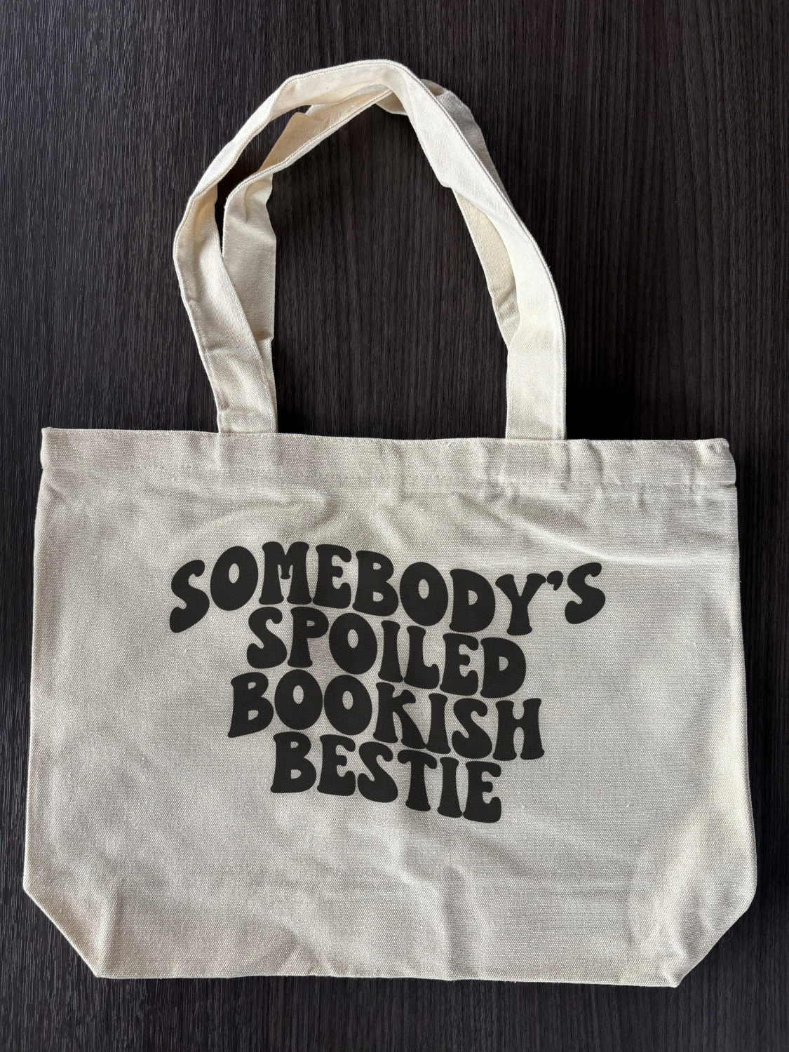 Flat lay of Spoiled Bookish Bestie tote