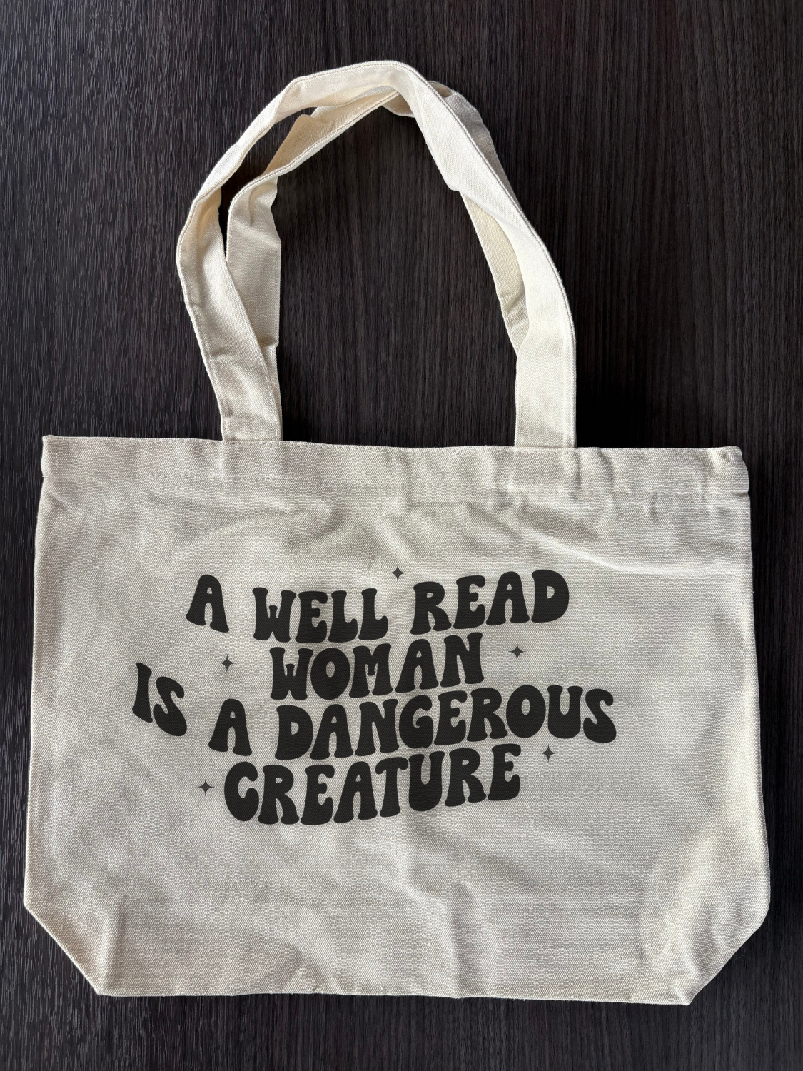 Flat lay of Bookish Canvas Tote Bag - A Well Read Woman Tote