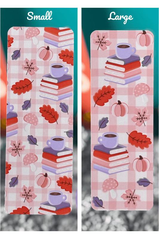 Pink plaid bookmark with stacked books, coffee mug, pumpkins, autumn leaves, and mushrooms in fall colors