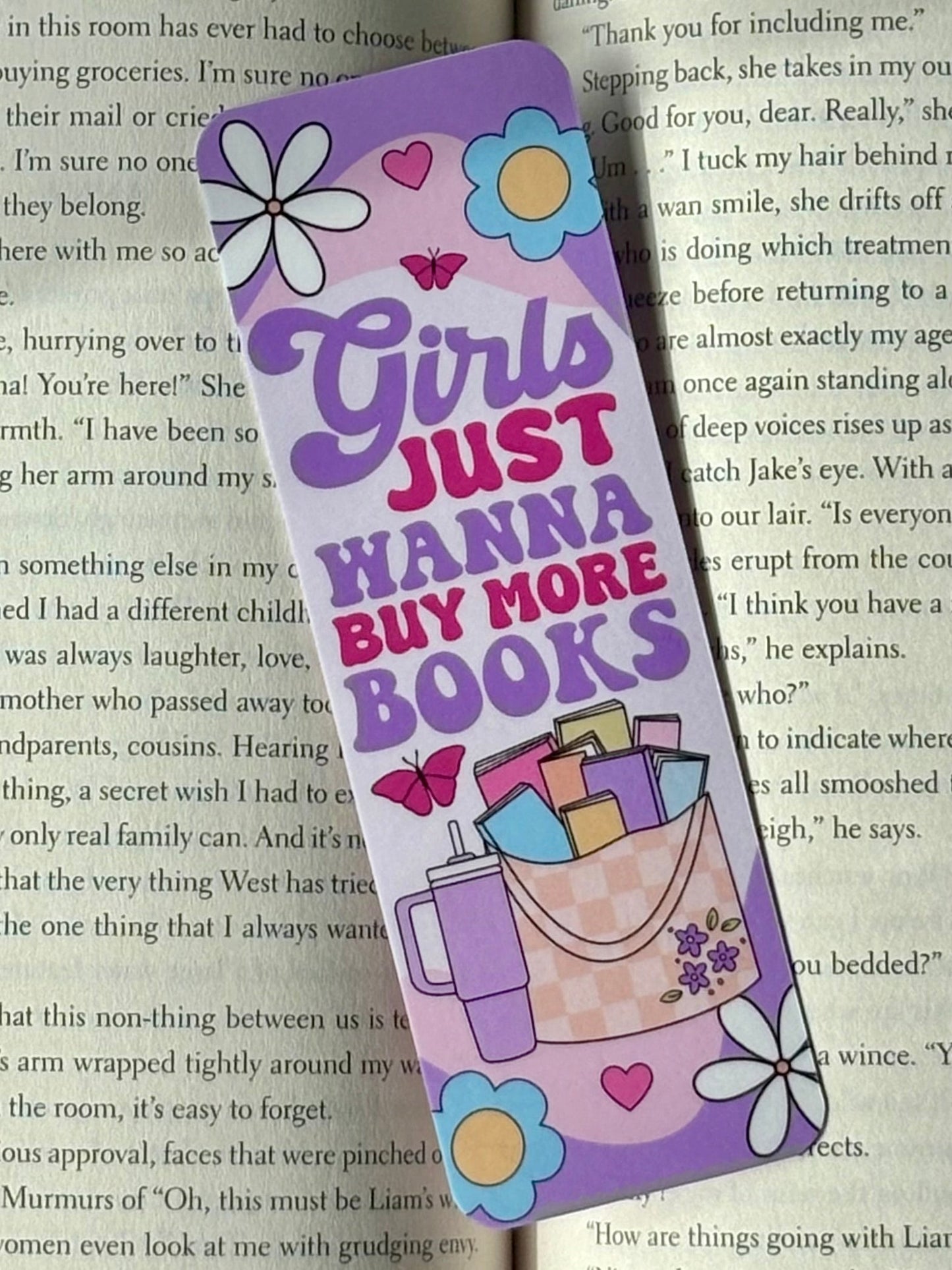 Bookmark with 'Girls Just Wanna Buy More Books' text on a book page