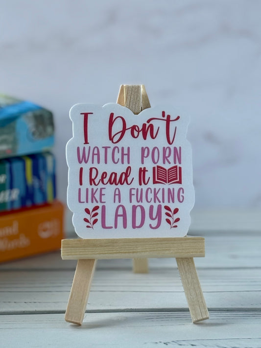 Sticker with pink and red retro text saying “I Don’t Watch Porn I Read It Like a fucking Lady.”
