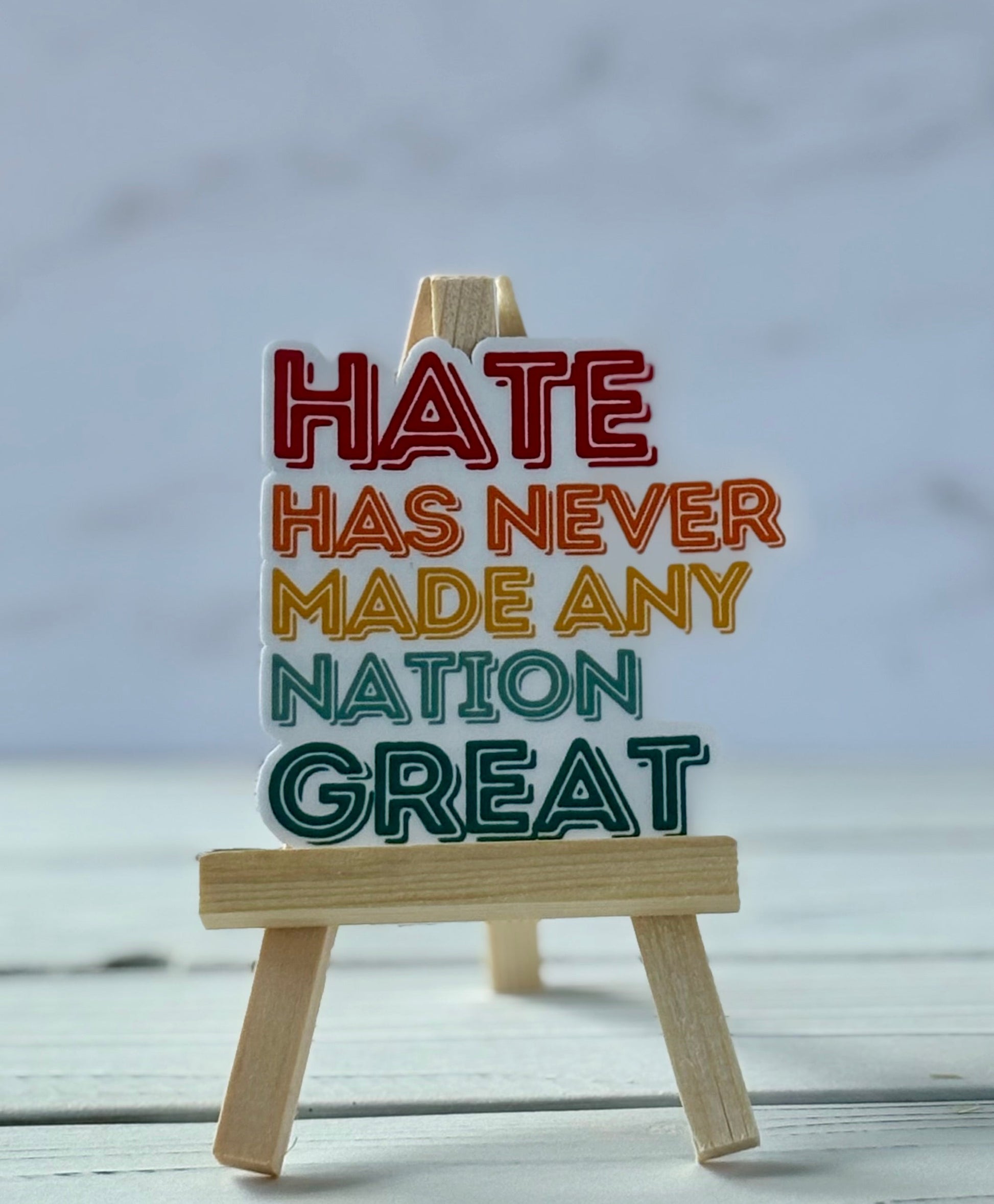 Hate Has Never Made Any Nation Great protest sticker in bold typography, jewel-tone colors, Snark for Social Change collection.