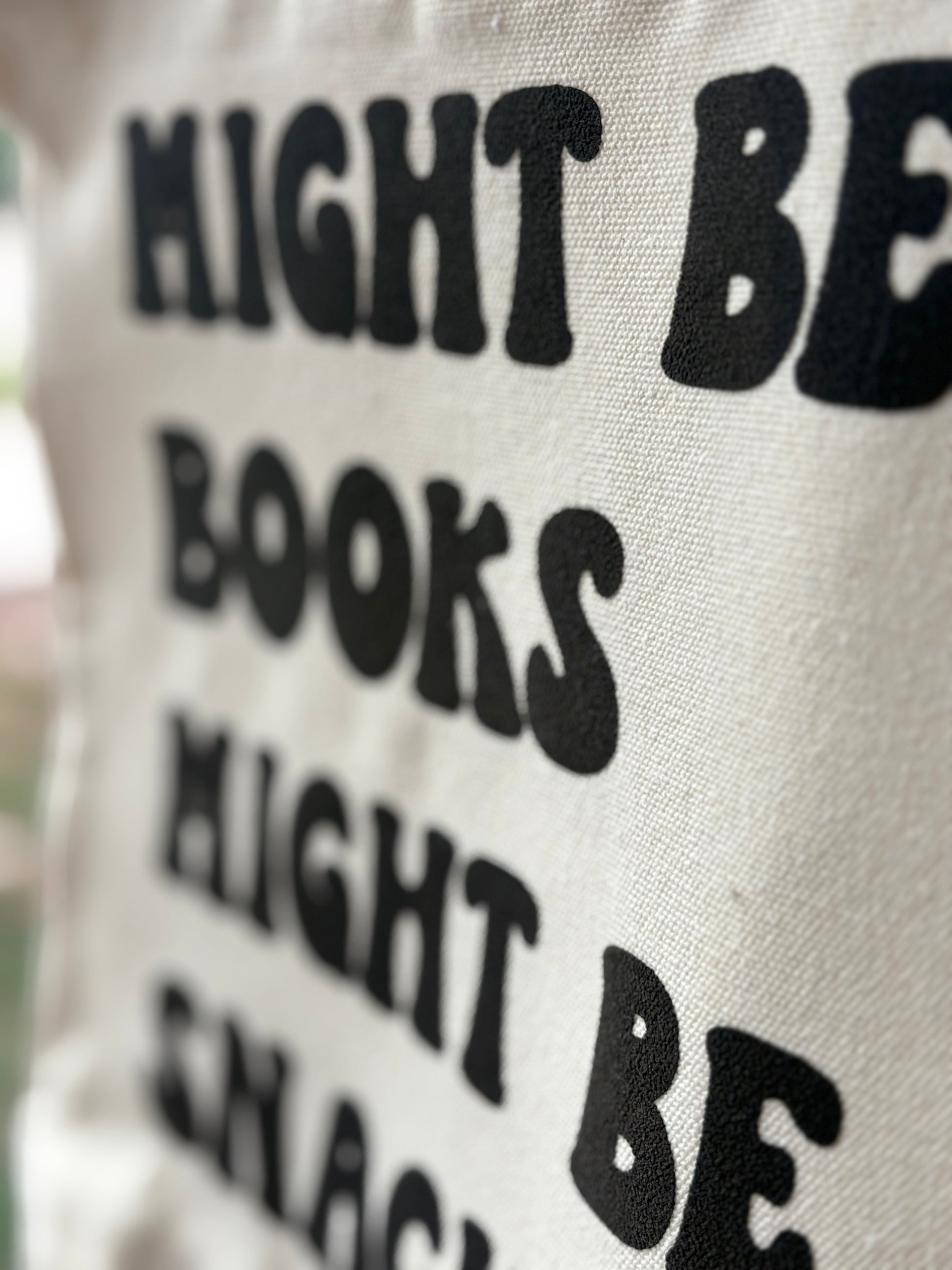 Close up view of text on canvas tote bag