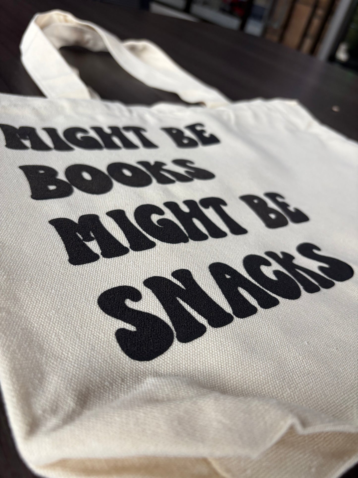 Alternative flat lay angle of bookish canvas tote bag