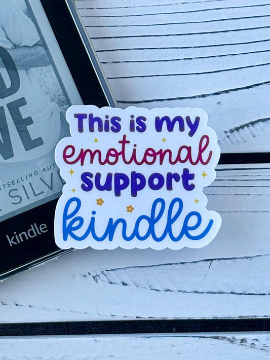 Text sticker that says ‘This is my emotional support Kindle’ in bold retro font on white background